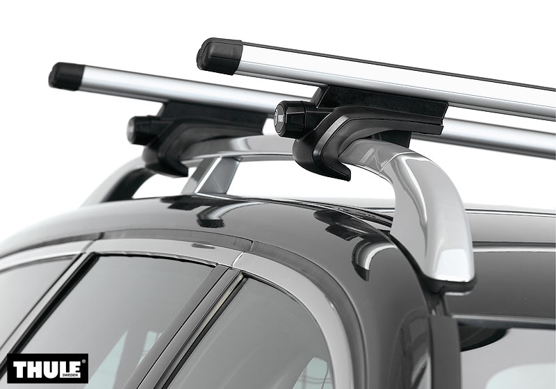The Roof Box Company: "for cars with roof rails" - you can push your hand under the bar. (Thule 757)